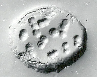 Drilled half almond seal — Unknown