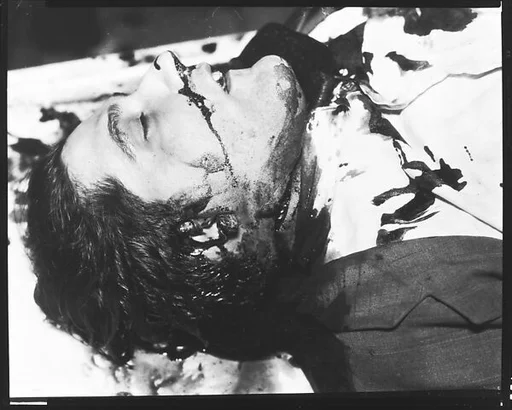 [Copy of Newspaper File Photograph: Blood-Stained Corpse, Probably Havana]