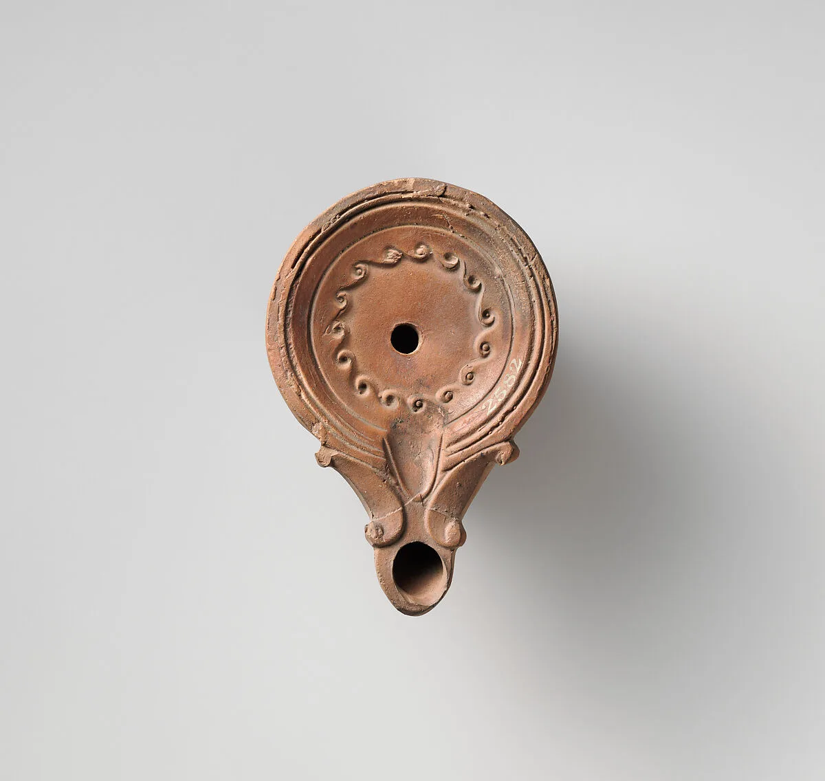 Terracotta oil lamp — Unknown