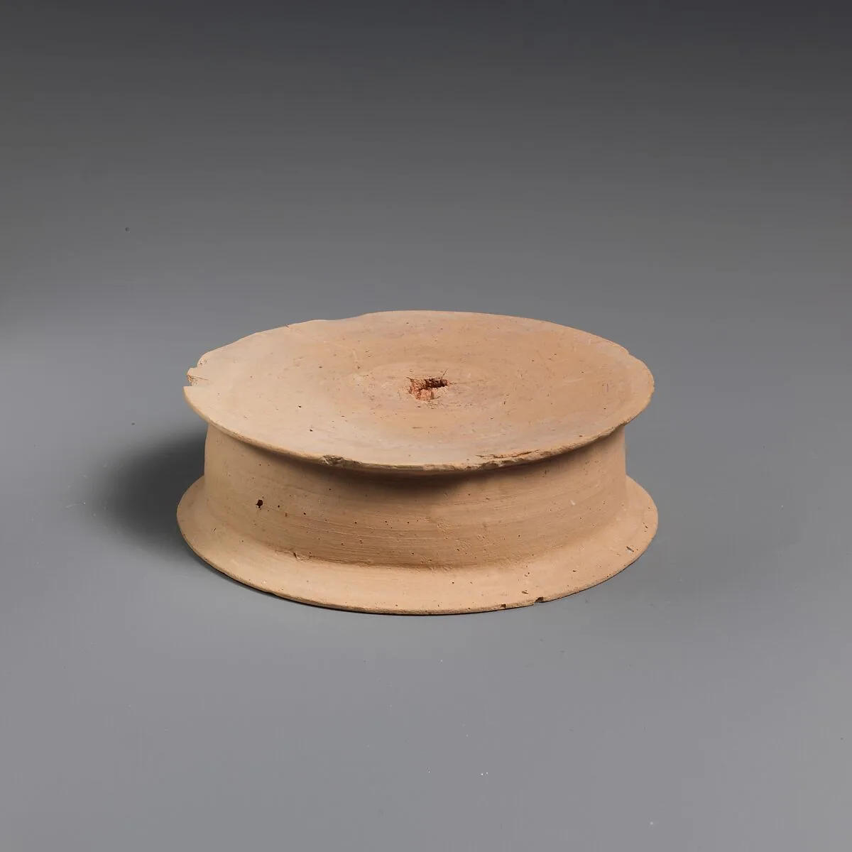 Terracotta statuette base — Unknown