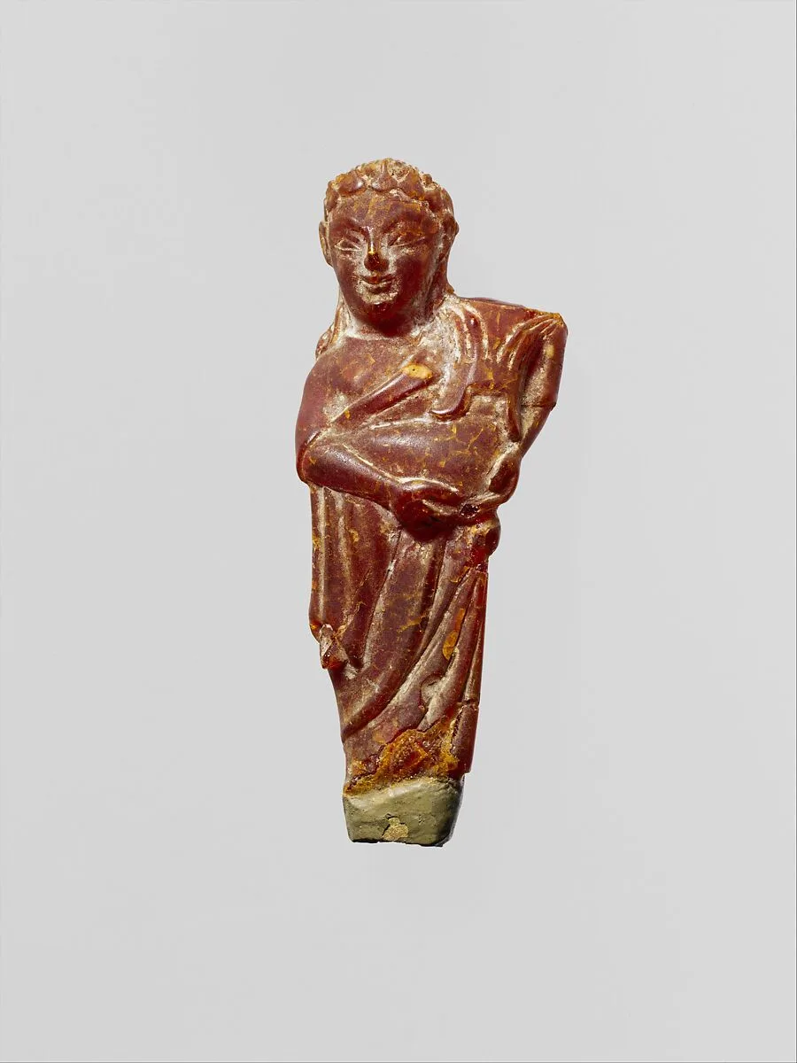 Pendant: woman carrying a child — Unknown