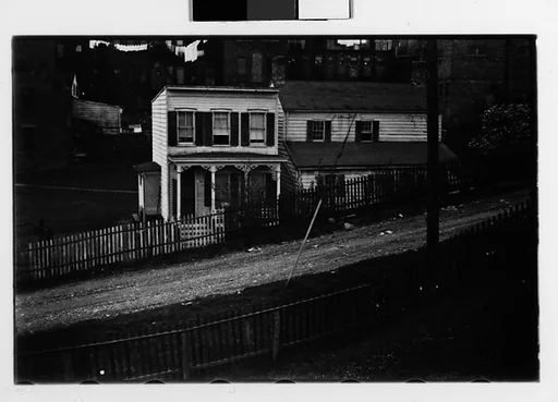 [Two 35mm Film Frames: Houses on Sloping Dirt Road with Picket Fences, Ossining, New York]