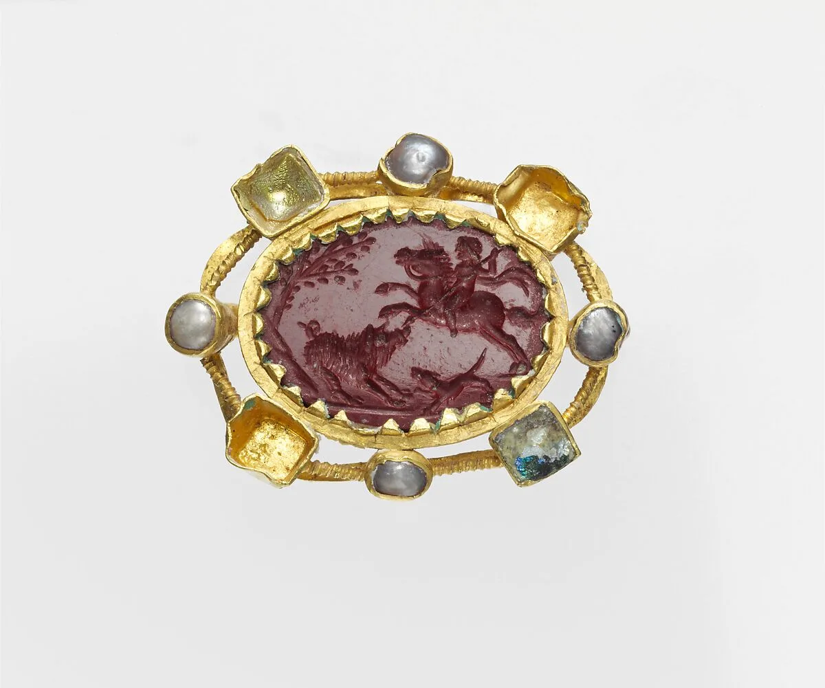 Jasper intaglio in a gold mount set with pearls and glass — Unknown