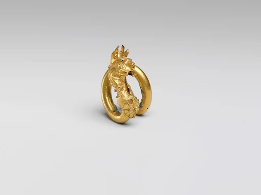 Gilt bronze spiral with griffin terminal