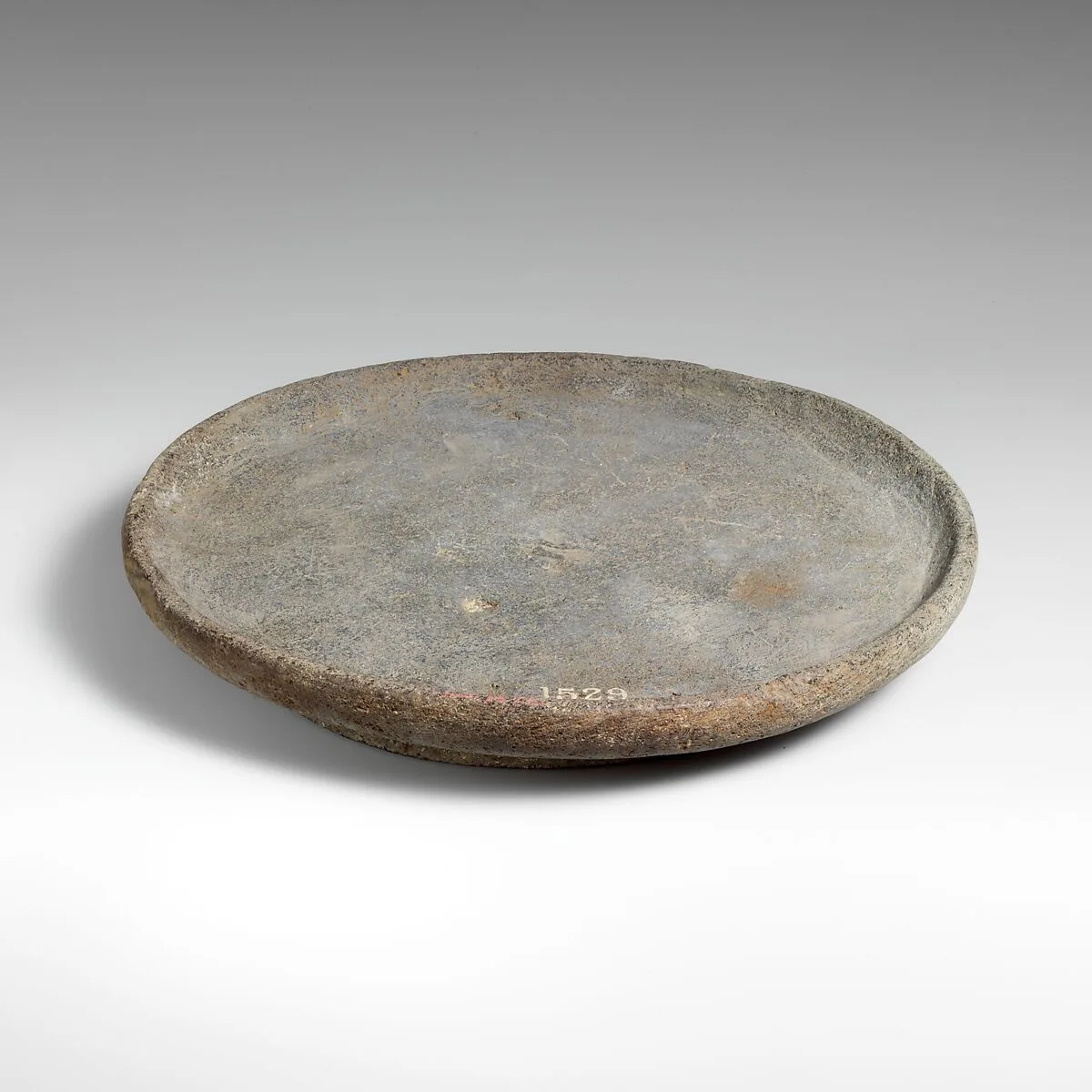 Basalt mortar or plate — Unknown