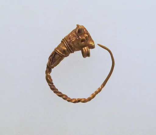 Gold earring with head of a bull