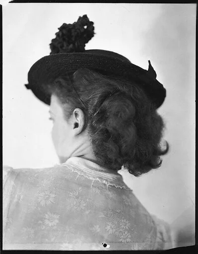 [Anne Harvey Wearing Hat, From Behind]