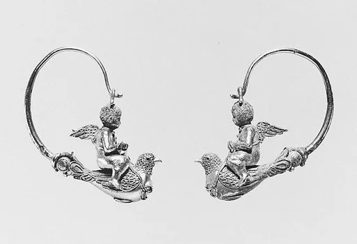 Pair of gold hoop earrings with Erotes riding doves
