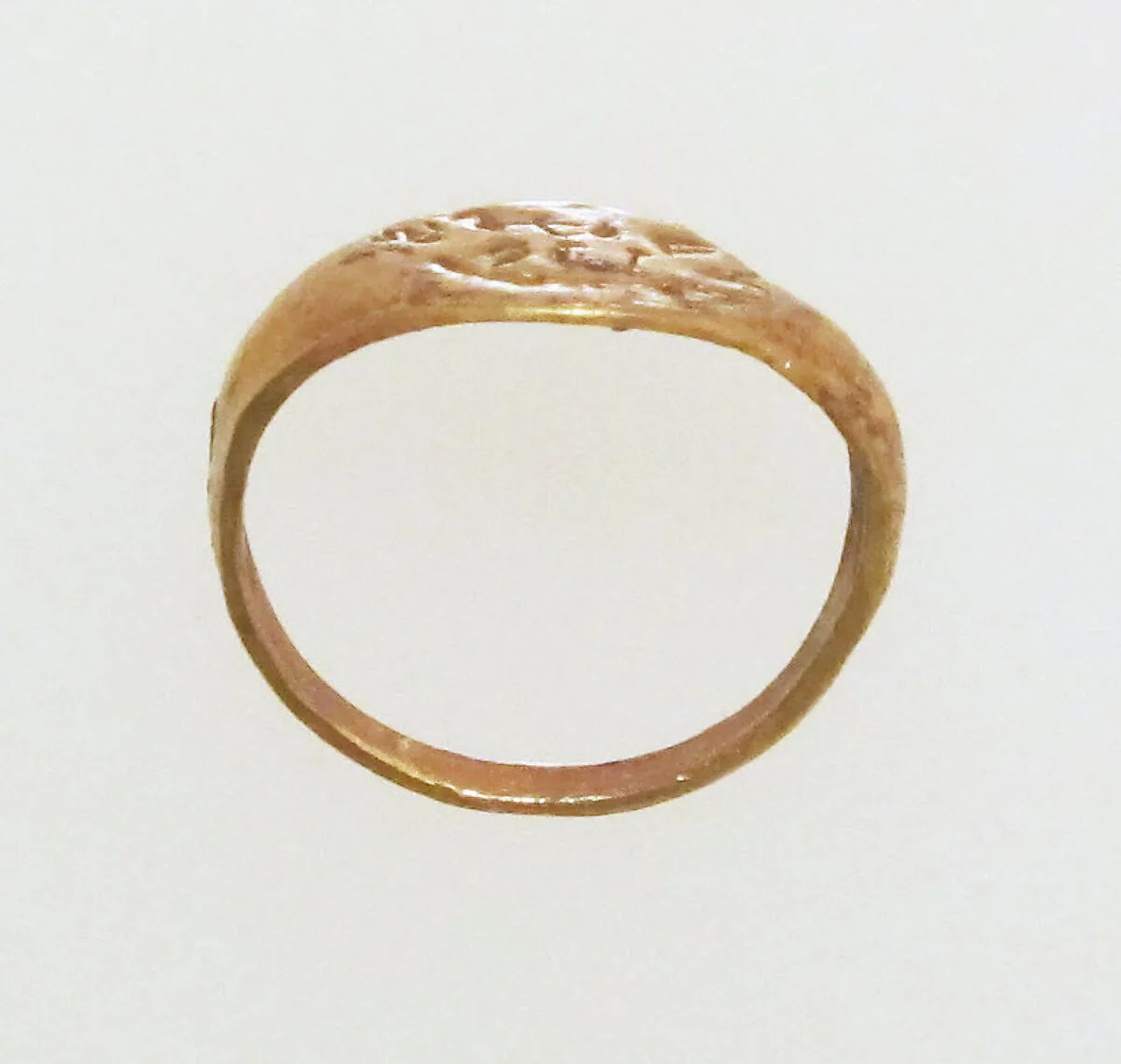 Gold ring with inscribed bezel — Unknown
