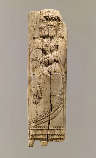 Furniture plaque with figure in relief