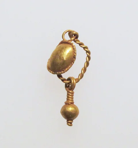 Gold earring with disc and pendant