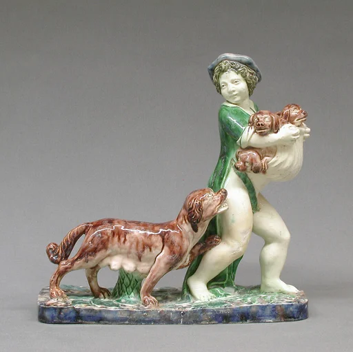 Boy carrying pups