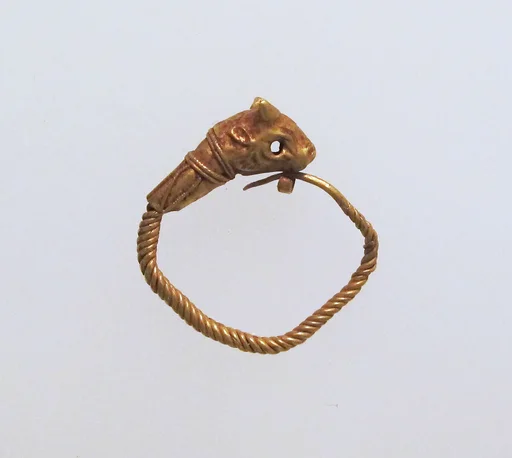 Gold earring with head of a bull