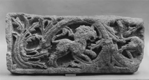 Fragment of a Frieze with Scrolls and a Lion