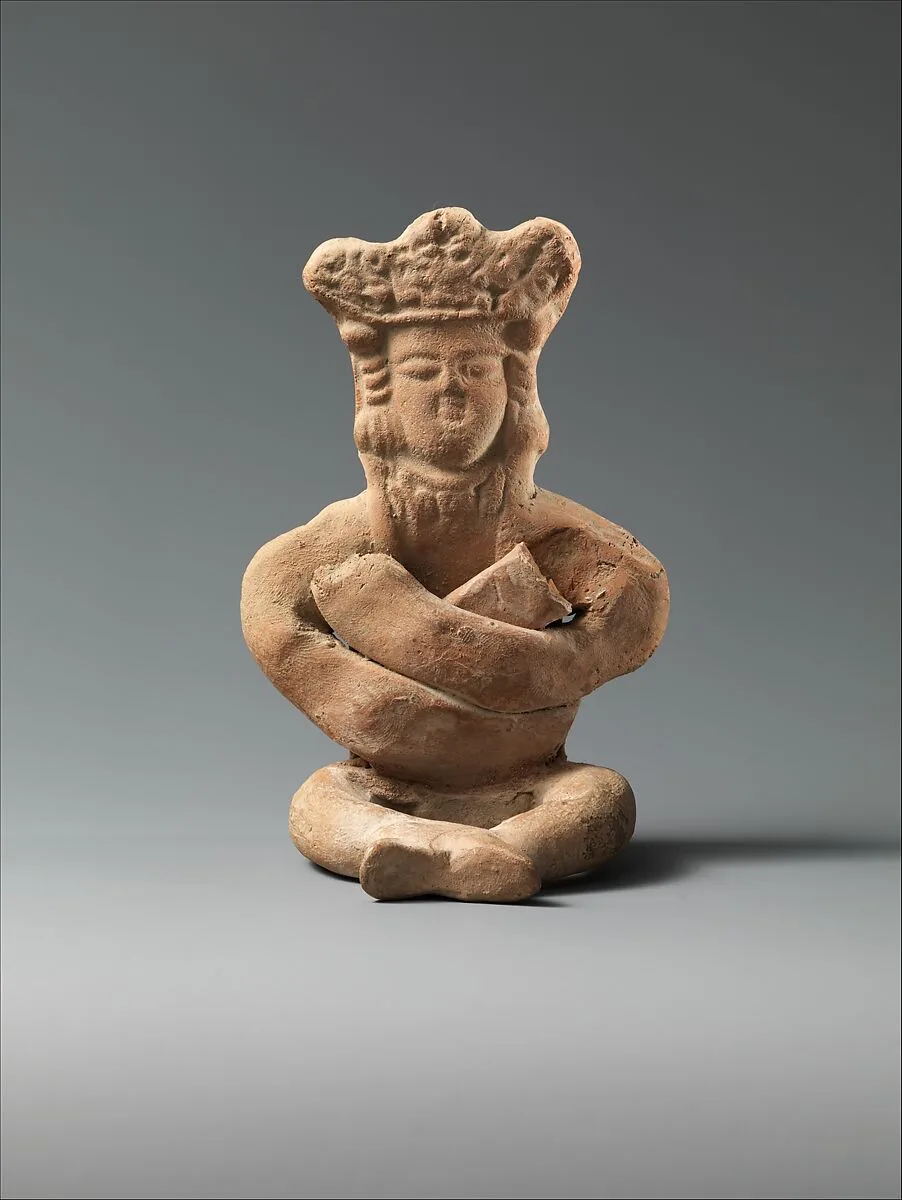 Figurine of a Seated Personage with Folded Arms and Elaborate Headdress — Unknown