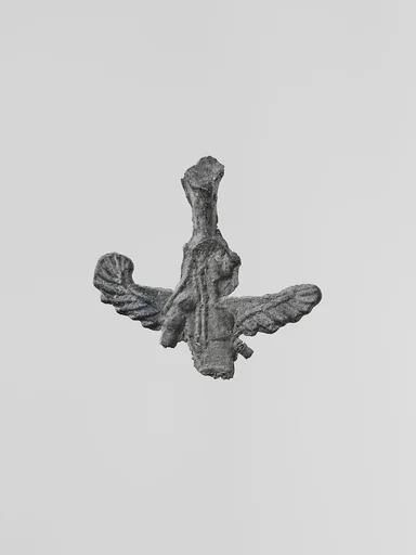 Lead figure of a winged goddess, possibly Artemis Orthia