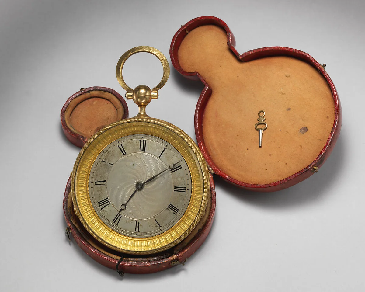 Round watch with key in original red leather case — Unknown