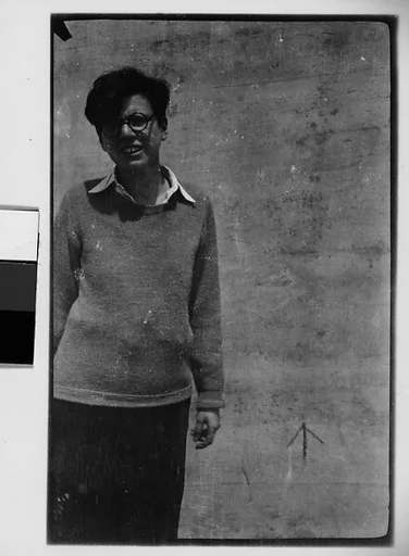 [Woman in Sweater and Horn-Rimmed Glasses]