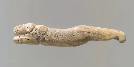 Amulet in the form of a lion with legs extended