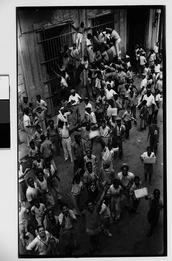 [Newsboys Climbing Iron Grillwork Door, Havana]