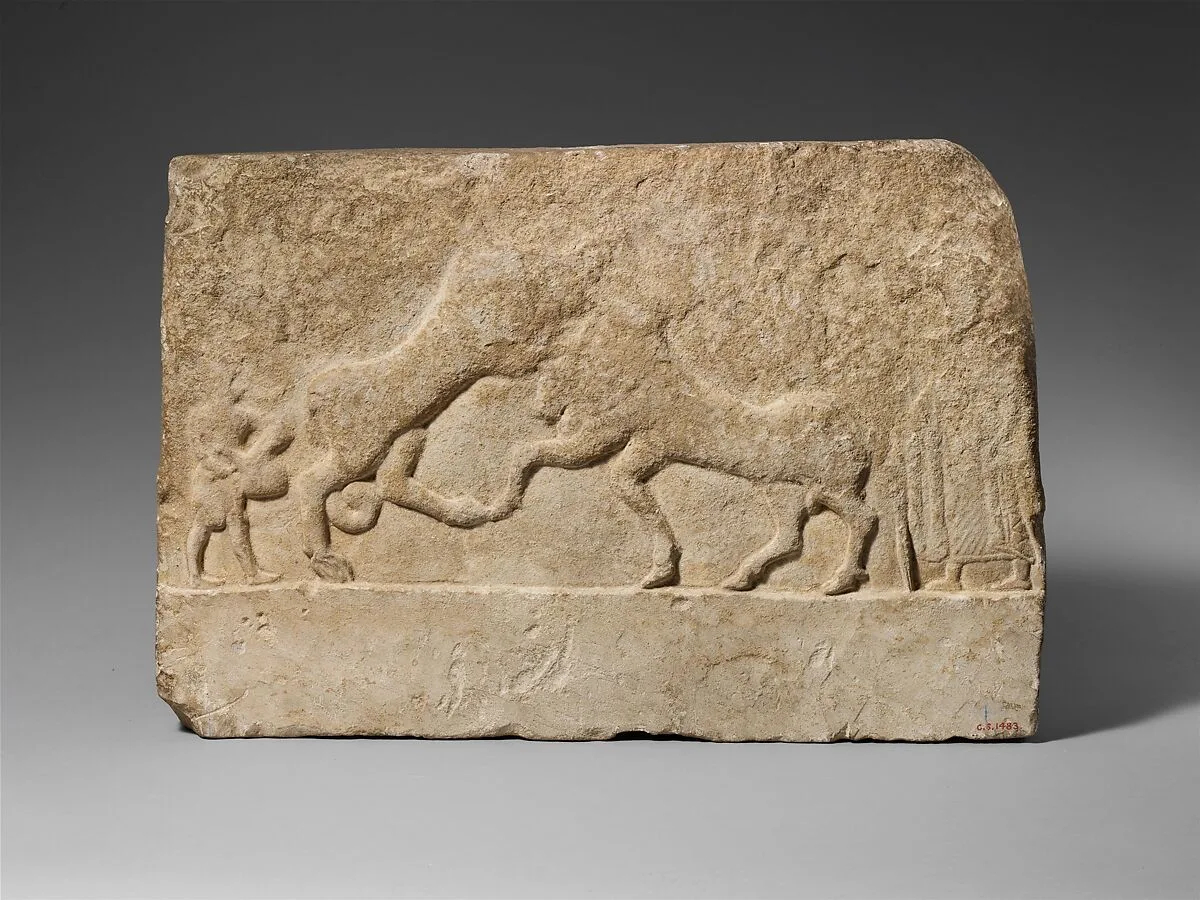 Limestone votive relief with a lion killing a bull and two human figures — Unknown