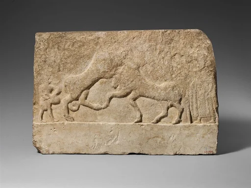 Limestone votive relief with a lion killing a bull and two human figures