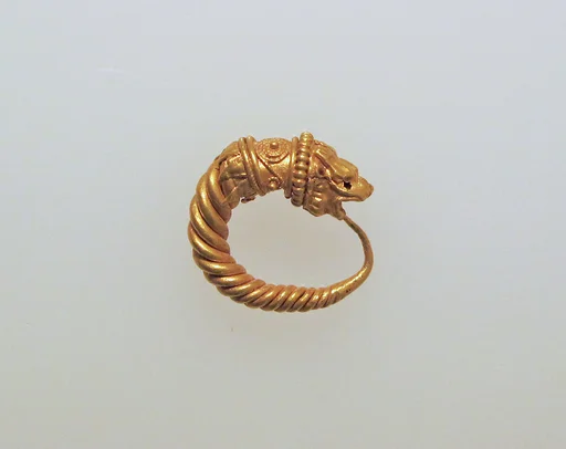 Gold earring with head of a lion