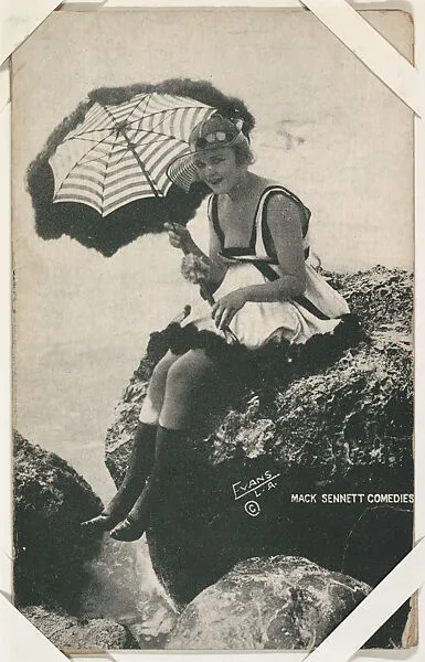 Bathing beauty with striped parasol from Mack Sennett Comedies Arcade series (W423) — Unknown