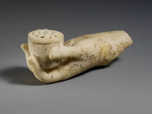 Marble left hand holding a small box