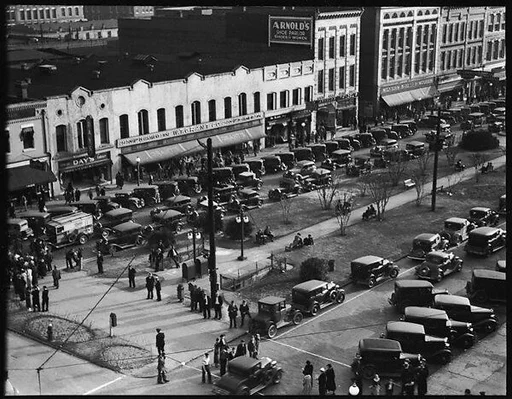 [Stores and Parked Cars on Main Street, From High Elevation, Macon, Georgia]