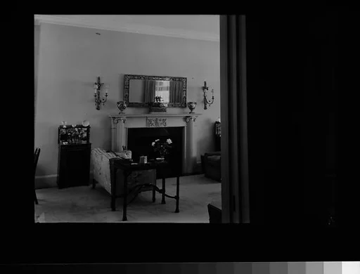 [Living Room Interior Showing Fireplace, Sofa, and Table]
