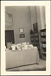 [Books Displayed on Table and Shelves at the Bateau Ivre Bookshop, Juan-les-Pins, France]
