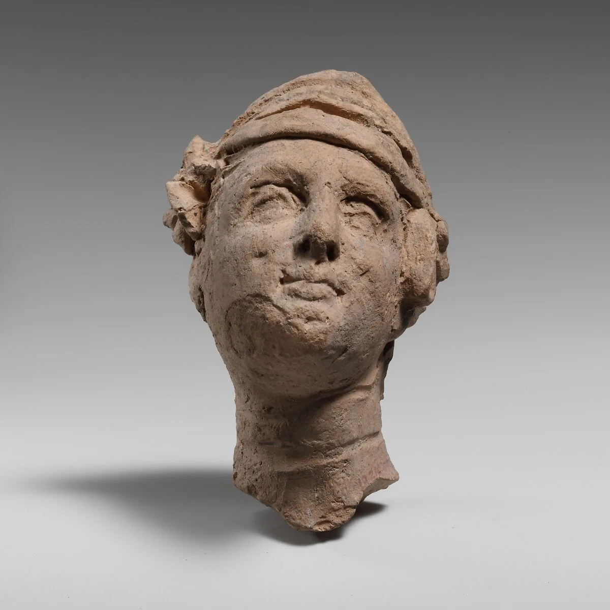 Terracotta head of a woman — Unknown