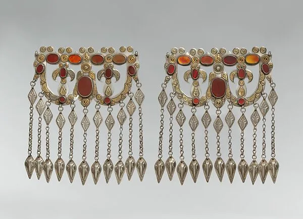 Dorsal Headdress Ornament, One of a Pair — Unknown
