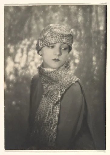 [Kiki Wearing Hat and Scarf of Gazelle Leather]