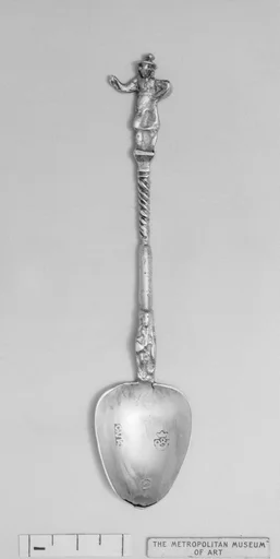 Figure-top spoon