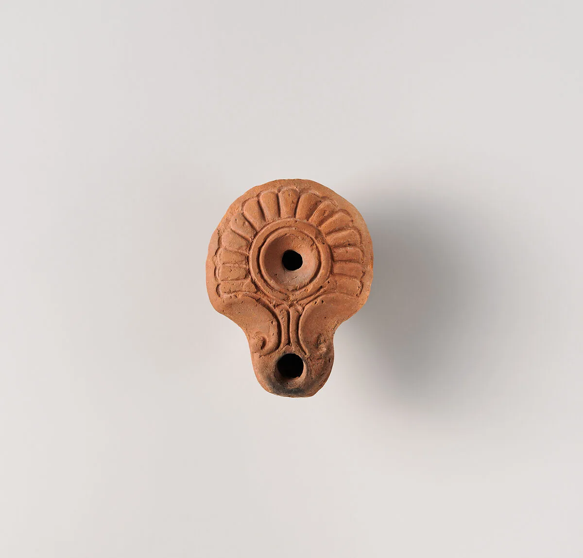 Terracotta oil lamp — Unknown