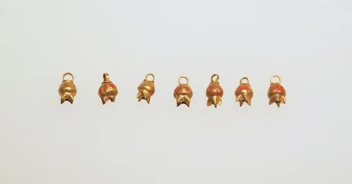 Bead with pomegranate