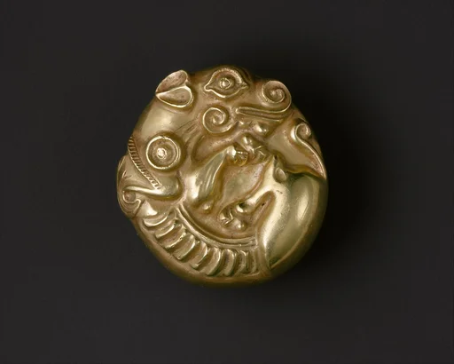 Pommel in the shape of coiled animals