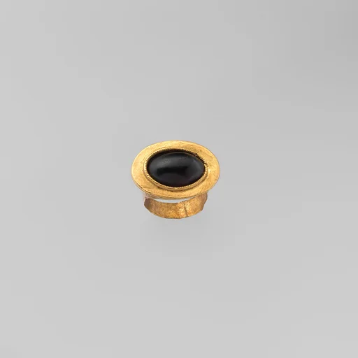 Gold and garnet ring
