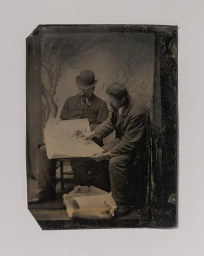 [Two Men Reviewing Plans]
