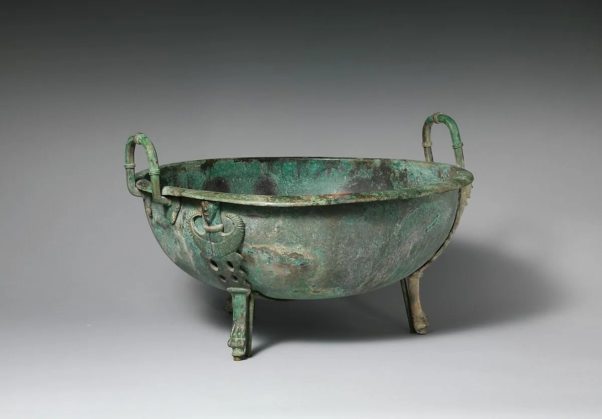 Bronze handled basin with three feet — Unknown