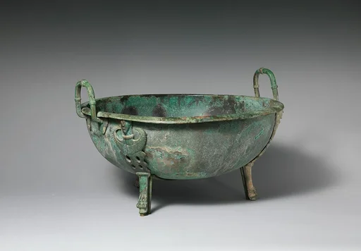 Bronze handled basin with three feet