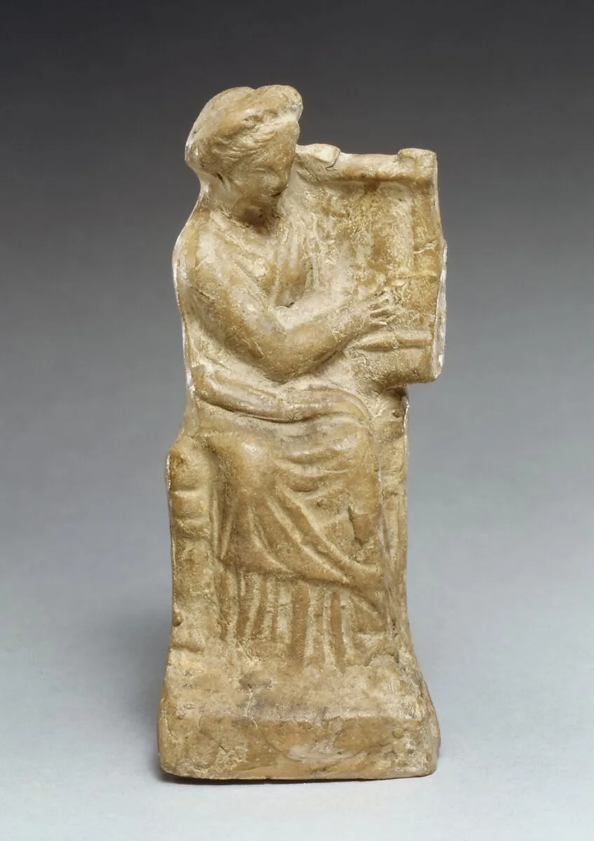 Terracotta statuette of a seated woman playing a kithera — Unknown