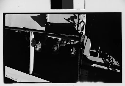 [Officers and Passengers on Deck of Docked Ship]