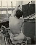 [Male Model Posed Pulling a Rope in Anna Huntington's Rooftop Studio]