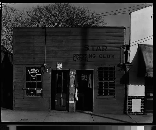 [Shopfront Façades of L. Miles Barber Shop and Star Pressing Club Laundry, Vicksburg, Mississippi]