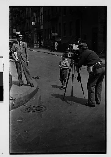 [Two 35mm Film Frames: Tintype Photographer and Man on Street Corner, New York City]