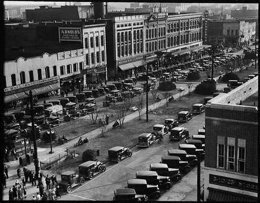 [Stores and Parked Cars on Main Street, From High Elevation, Macon, Georgia]