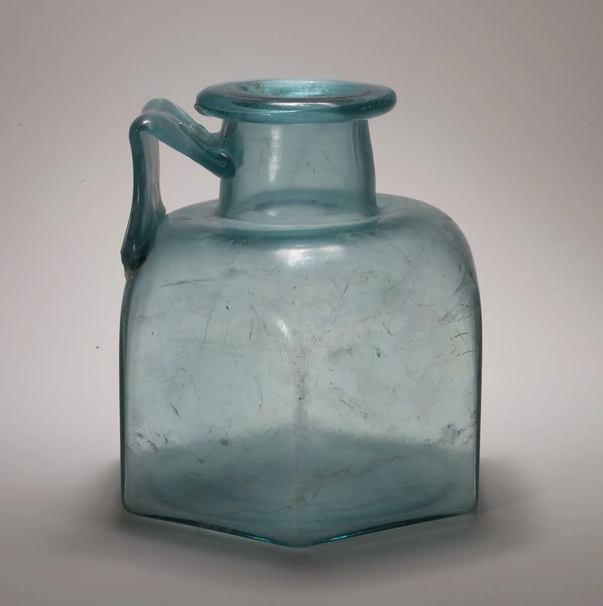 Glass one-handled hexagonal bottle — Unknown